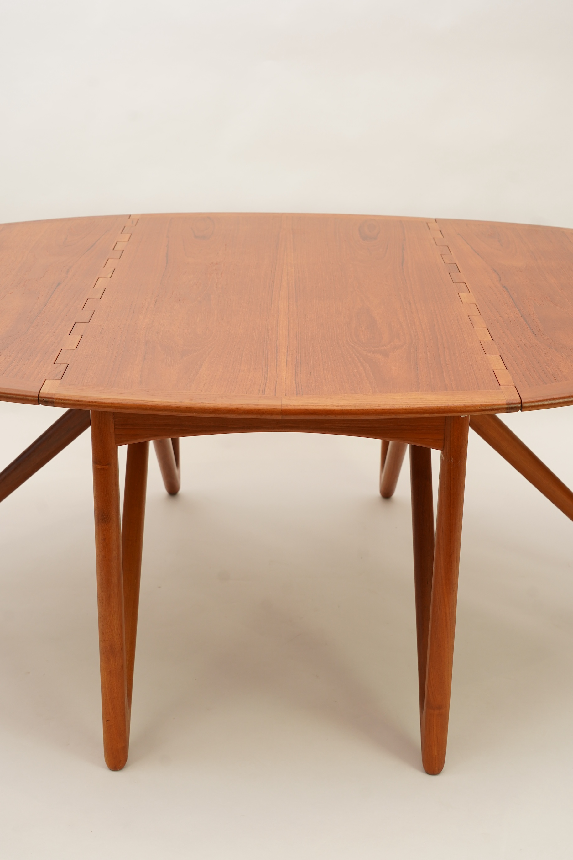 Niels Koefoed (Danish, b. 1929) for Koefoeds Møbelfabrik: A teak 'Oval Klap' dining table